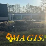 a building with a large rock in the middle